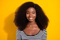 Photo portrait of cheerful pretty girl smiling in striped shirt isolated on bright yellow color background Royalty Free Stock Photo