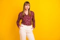 Photo portrait of confident business woman wearing floral blouse smiling isolated bright yellow color background Royalty Free Stock Photo