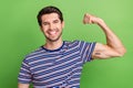 Photo portrait of cool successful sportsman athlete showing his good form fist power motivation isolated on green color