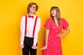 Photo portrait of couple cheerful looking on each other on date flirty charming isolated on vivid yellow background