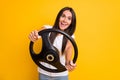 Photo portrait crazy brunette keeping steering wheel want to get license on vivid yellow color background
