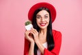 Photo portrait of crazy girl holding small cactus plant in two hands isolated on pastel pink colored background Royalty Free Stock Photo