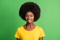 Photo portrait of disgusted curly girl dissatisfied isolated on bright green color background