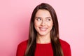 Photo portrait of dreamy smiling female student with brunette hair thinking about idea isolated on pink color background Royalty Free Stock Photo