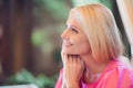 Photo portrait elder woman beautiful attractive with blonde hair in pink clothes smiling dreamy cheerful