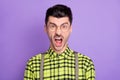Photo portrait of enraged screaming man isolated on vivid violet colored background