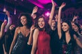 Photo portrait of excited young people dancing together at nightclub ladies wearing beautiful red shiny fancy elegant