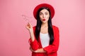 Photo portrait of flirty girl sending air kiss taking off glasses isolated on pastel pink colored background