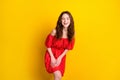 Photo portrait of funky girl laughing in red fancy printed dress isolated bright yellow color background Royalty Free Stock Photo