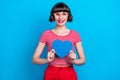 Photo portrait girl in glasses smiing showing heart isolated vivid blue color background