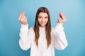 Photo portrait girl in white hoody unhappy arguing showing italian sign isolated pastel blue color background