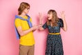 Photo portrait of girlfiend arguing with boyfriend blogger misunderstanding isolated on pastel pink color background