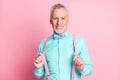 Photo portrait of handsome attractive senior man with toothy smile keeping suspenders bowtie shirt isolated on pink Royalty Free Stock Photo