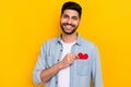 Photo portrait of handsome latin young man get valentine present girlfriend wear stylish denim outfit isolated on yellow Royalty Free Stock Photo