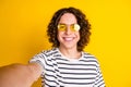 Photo portrait of handsome teenager guy toothy smile selfie photo sunglass wear trendy striped garment isolated on