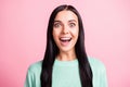 Photo portrait of happy amazed brunette wearing teal sweater staring opened mouth isolated on pastel pink color