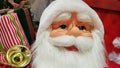 Photo portrait of a happy toy doll Santa Claus with a bag of gifts symbolizes the coming of Christmas and New Year. Festive mood,