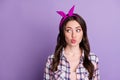 Photo portrait of impressed pouting girl looking at blank space isolated on vivid purple colored background Royalty Free Stock Photo