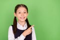 Photo portrait little girl smiling showing finger copyspace isolated pastel green color background Royalty Free Stock Photo