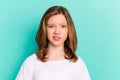 Photo portrait little girl unhappy displeased grimacing wearing white t-shirt isolated vibrant teal color background