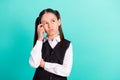 Photo portrait little girl unsure thoughtful got idea isolated pastel turquoise color background