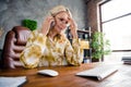 Photo portrait of lovely mature woman talk phone confused solve problem dressed stylish shirt office day light home Royalty Free Stock Photo