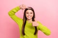 Photo portrait of lovely teen lady hands frame cadre photographer model wear trendy green outfit isolated on pink color