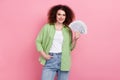 Photo portrait of lovely young lady hold money fan dollars wear trendy green garment isolated on pink color background Royalty Free Stock Photo