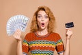 Photo portrait of lovely young lady hold shock money dollars credit card dressed stylish striped garment isolated on Royalty Free Stock Photo
