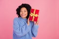 Photo portrait of lovely young lady listen receive present dressed stylish blue knitted garment isolated on pink color Royalty Free Stock Photo