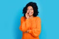 Photo portrait of lovely young lady share secret look empty space dressed stylish knitted orange garment isolated on