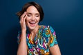 Photo portrait of lovely young lady touch face laughing closed eyes wear trendy flared pants garment isolated on dark Royalty Free Stock Photo