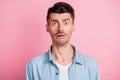 Photo portrait of nervous stressed man staring lost forgot worried frustrated isolated pastel pink color background