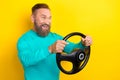 Photo portrait of nice retired man driving fast car steering wheel banner wear trendy aquamarine outfit  on Royalty Free Stock Photo