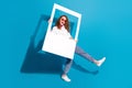 Photo portrait of nice young lady walk step sunglass hold instant photo frame wear trendy white garment isolated on blue Royalty Free Stock Photo