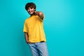 Photo portrait of nice young male touch neck posing model wear trendy striped yellow garment isolated on aquamarine