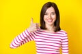 Photo portrait of nice young woman thumb up positive feedback concept dressed stylish striped clothes isolated on yellow Royalty Free Stock Photo