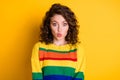 Photo portrait of pouting girl isolated on bright yellow colored background