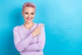 Photo portrait of pretty girl pink dyed hair direct index finger empty space information news isolated blue color Royalty Free Stock Photo