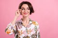 Photo portrait pretty girl smiling wearing printed shirt glasses looking copyspace isolated pastel pink color background Royalty Free Stock Photo