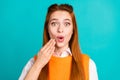 Photo portrait of pretty young girl cover mouth shocked wear trendy orange knitwear outfit isolated on cyan color Royalty Free Stock Photo