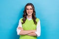 Photo portrait of pretty young girl eyeglasses folded arms specialist employee wear trendy green outfit isolated on blue Royalty Free Stock Photo