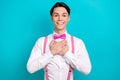 Photo portrait of pretty young male touch chest grateful impressed dressed stylish pink outfit isolated on aquamarine Royalty Free Stock Photo