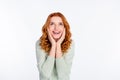 Photo portrait of red haired young girl looking blank space smiling touching cheeks amazed isolated on white color Royalty Free Stock Photo