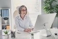 Photo portrait of retired grandma working computer manager ceo boss businesswoman modern loft style interior workplace