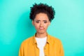 Photo portrait sad grumpy woman curly hair isolated bright teal color background