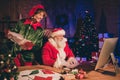 Photo portrait of santa claus and elf browsing email box holding paper cards Royalty Free Stock Photo