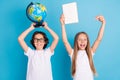 Photo portrait schoolboy schoolgirl studying at school isolated pastel blue color background