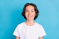 Photo portrait schoolboy smiling in white t-shirt isolated pastel blue color background