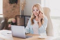 Photo portrait smiling happy business woman wearing glasses sitting at table talking on cellphone Royalty Free Stock Photo